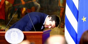 Greek Prime Minister Tsipras bows as he arrives to lead a news conference with his Italian counterpart Renzi at Chigi palace in Rome