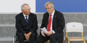 German Finance Minister Schaeuble talks with Eurogroup president Juncker in Wroclaw